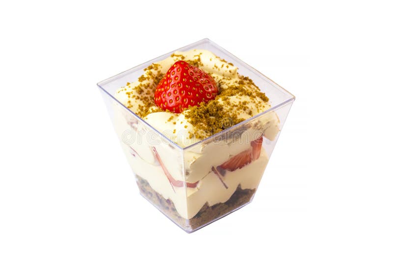 Creamy cream dessert in a plastic cup decorated with berries