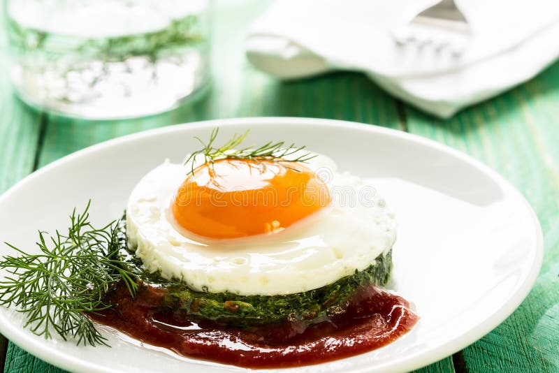Creamy Spinach with Fried Egg Stock Image Image of straw, cooking