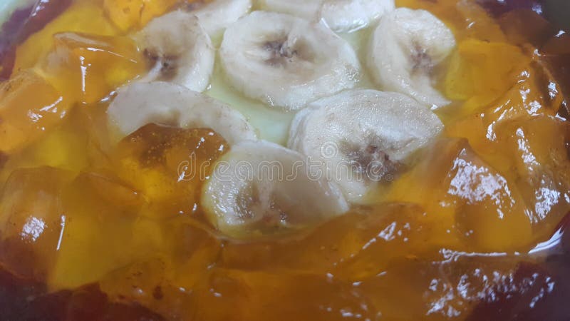 Creamy tasty sweet custard with banana pieces layered on surface. A close up tope view of home made custard, a dairy products for dessert after meal stock photo Creamy tasty sweet custard with banana pieces layered on surface. A close up tope view of home made custard, a dairy products for dessert after meal stock photo