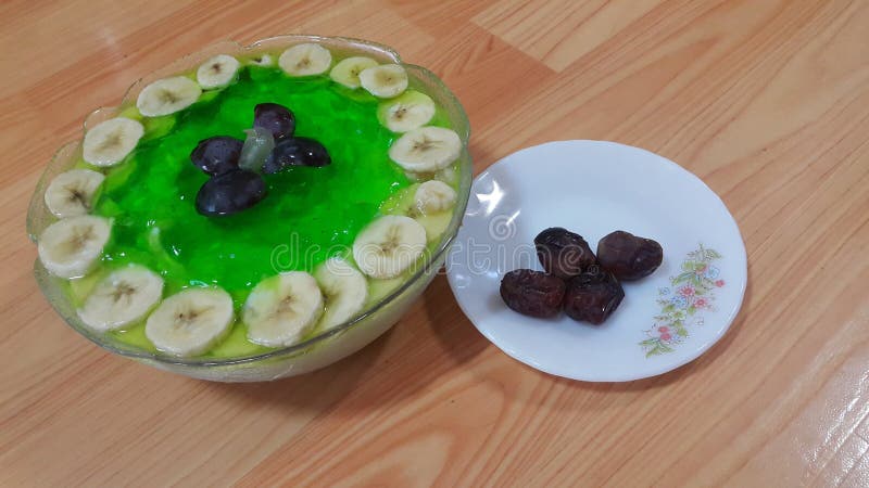 Creamy tasty sweet green jelly with banana slices layered on surface royalty free stock images Creamy tasty sweet green jelly with banana slices layered on surface royalty free stock images