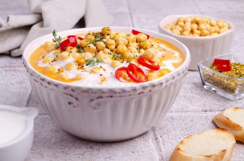 Creamy Vegetable Soup with Chickpeas Stock Image - Image of plate