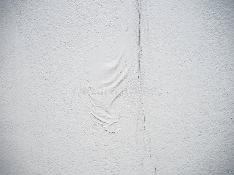 Crease and rift texture on white cement wall background with copy space royalty free stock images Crease and rift texture on white cement wall background with copy space royalty free stock images