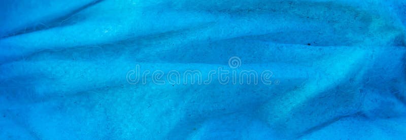 Creased blue cotton fabric. background royalty free stock photos