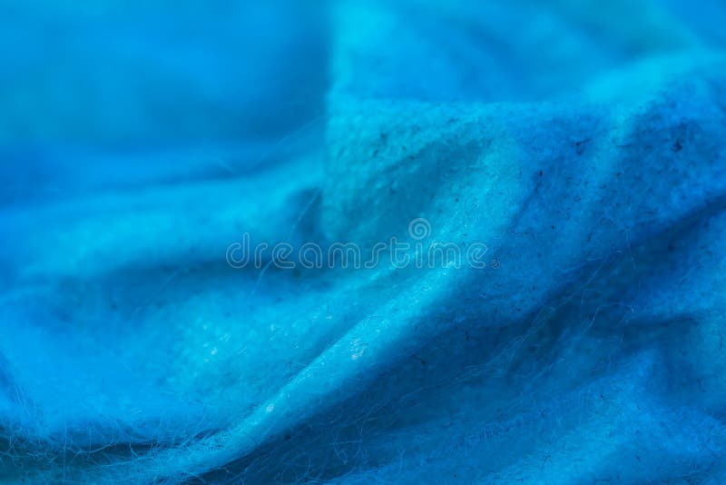 Creased blue cotton fabric. background royalty free stock images