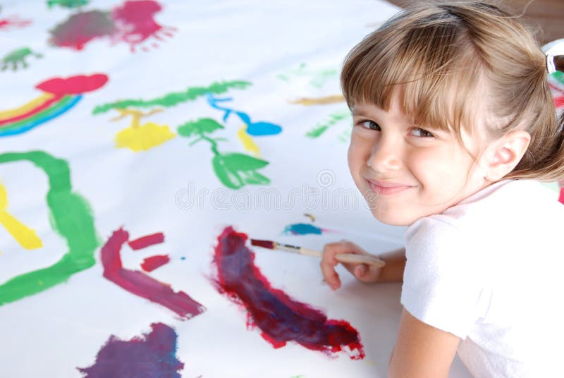 A cute young girl painting a picture. Pan drawing stock images, royalty-free photos and pictures