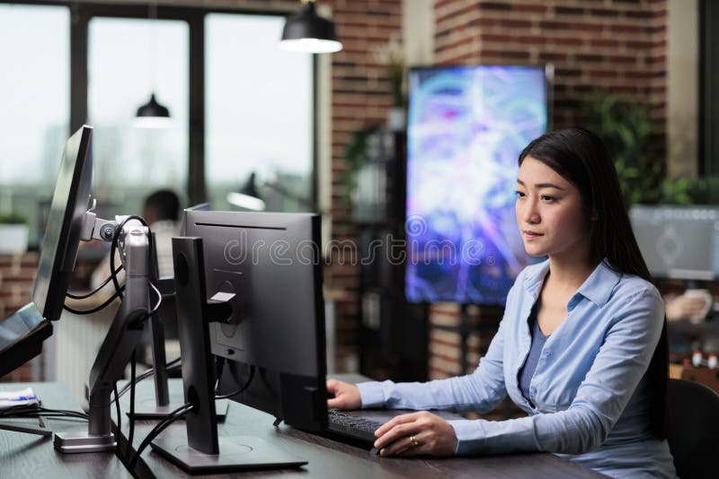 Creative agency employee working on developing digital project while sitting at desk. royalty free stock image