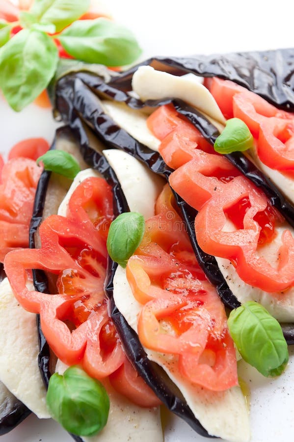 Appetizer Aubergine with Mozzarella, Tomato and Basil Stock Image