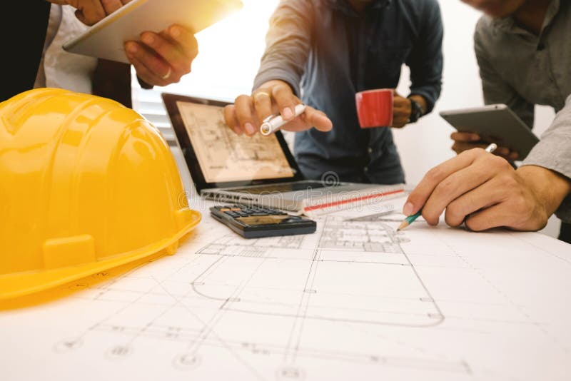 Creative architect projecting on the big drawings stock photography