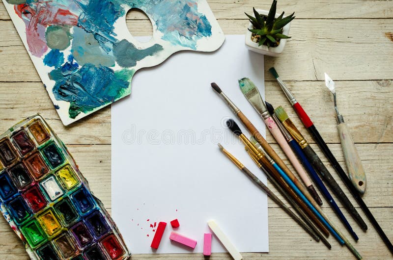 Creative artist workplace flat lay, mockup on wooden background