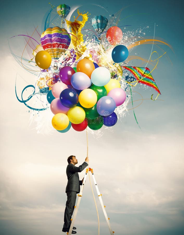 Creative businessman with colorful balloon explosion