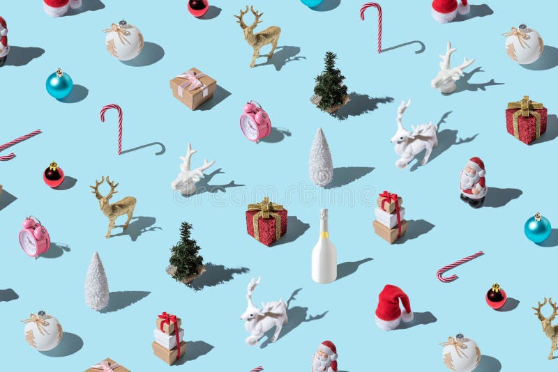 Creative Christmas pattern made of various winter and New Year things on bright blue background. Minimal Christmas or New Year