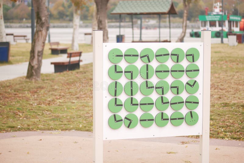 Creative clock display encourages time learning in park royalty free stock photography