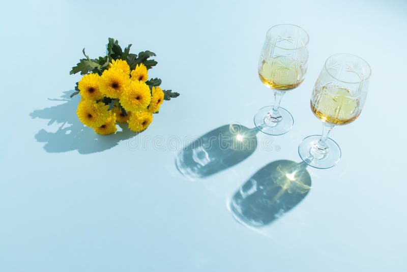 Creative composition with 2 glasses of drinks and a bouquet of flowers. Valentines or woman&x27;s day background design