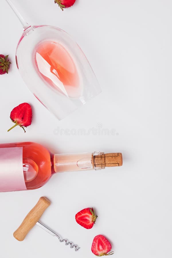 Creative Composition with Rose Wine and Strawberries Stock Photo