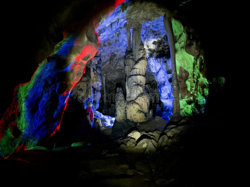 Creative concept created with cave interior texture, stalactites, stalagmites and colors stock image