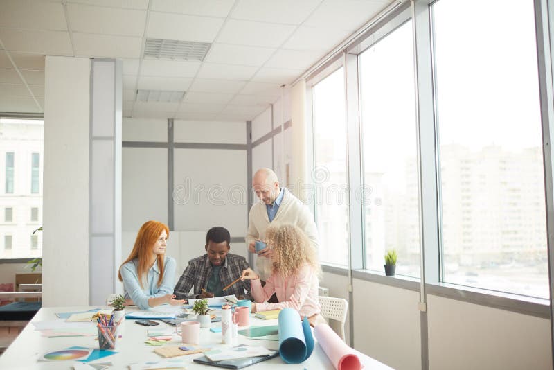 Creative Designers in Open Office stock images