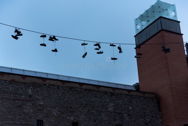 A creative display of colorful shoes hanging on a rope. royalty free stock photo