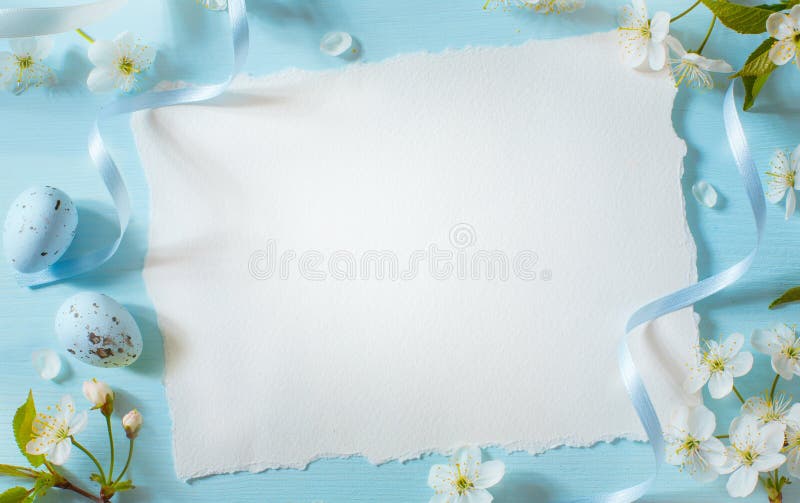 Creative easter flat lay design with white paper blank and spring flowers stock photography