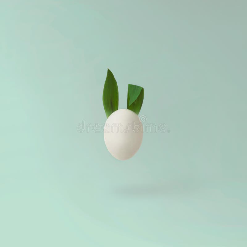 Creative Easter minimal concept - Easter egg with bunny ears stock photos
