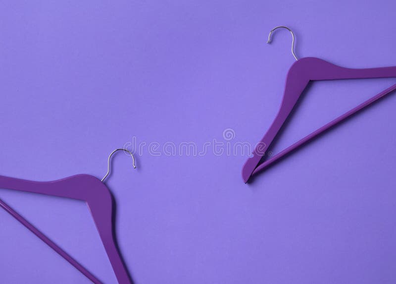 Creative Flat Lay Violet Wooden Hangers At Purple Background With Copy Space