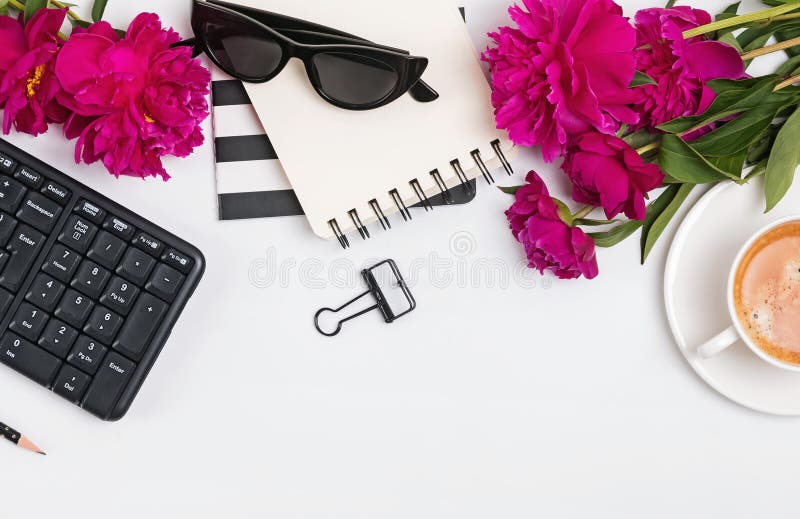 Creative frame with beautiful feminine accessories, office supplies and pink peonies stock images Creative frame with beautiful feminine accessories, office supplies and pink peonies stock images