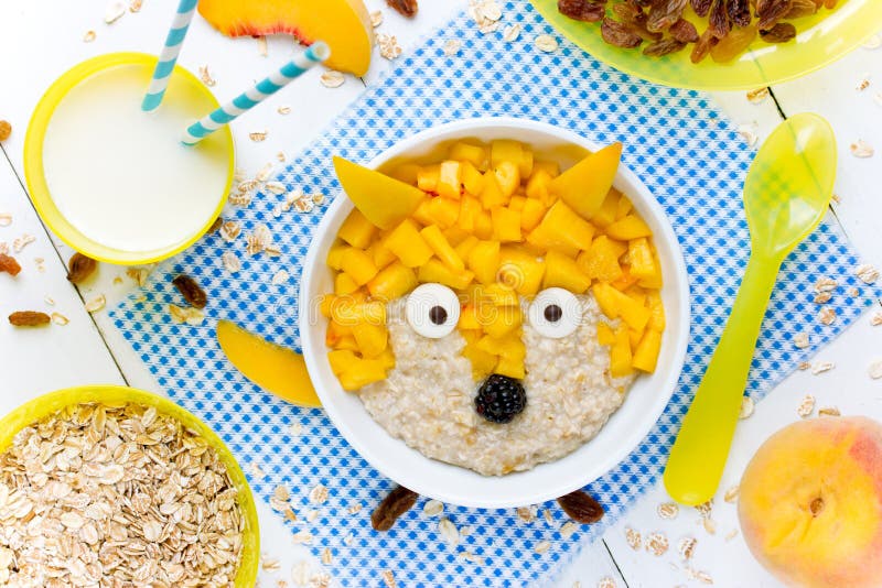 Creative idea for kids breakfast oatmeal healthy bowl with fruit