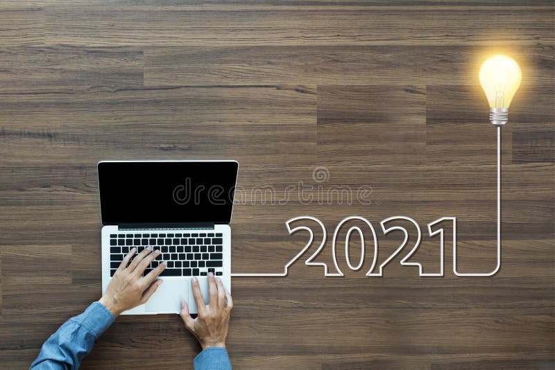 Creative light bulb idea 2021 new year, With businessman working on laptop