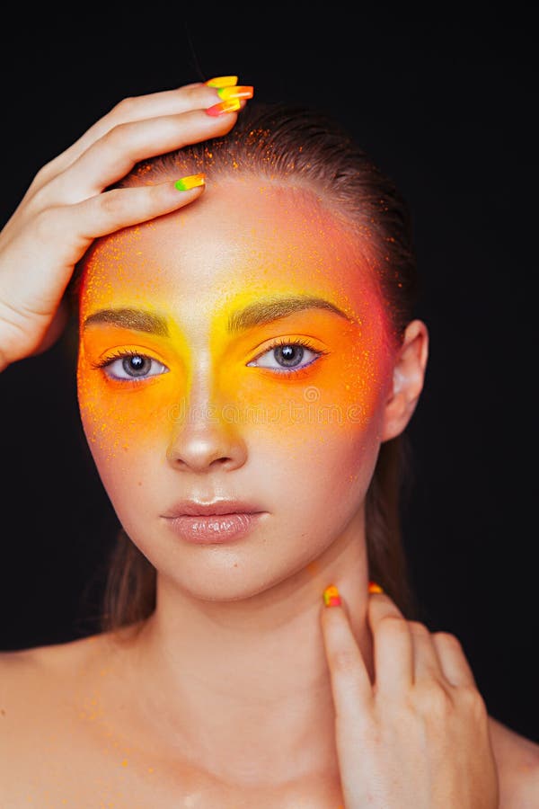 Creative make-up of colored powder closeup. Colored nail design. Studio stock photo Creative make-up of colored powder closeup. Colored nail design. Studio stock photo