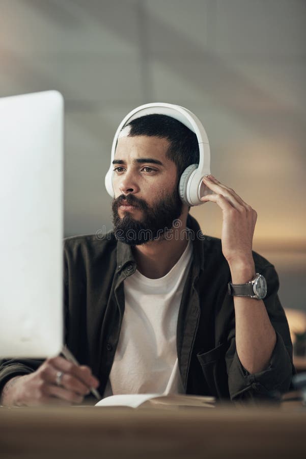 Creative, man and headphones with computer, idea and video editor with night and writing for project. Content creation royalty free stock photography