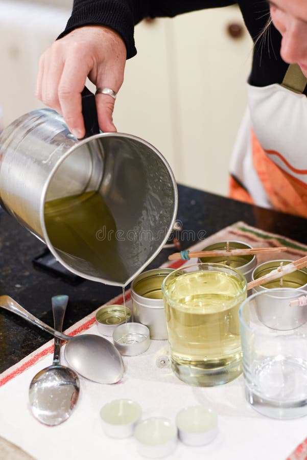 Creative Occupation of Candle Making Showing the Pouring of Liquid Wax