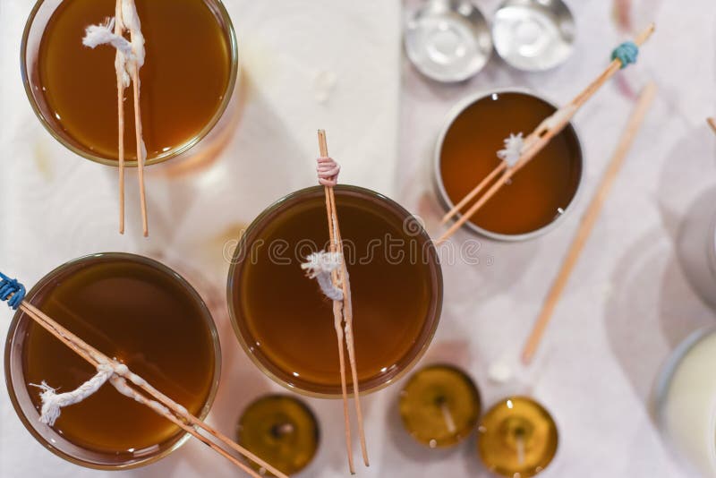 Creative Occupation of Candle Making Showing the Pouring of Liquid Wax
