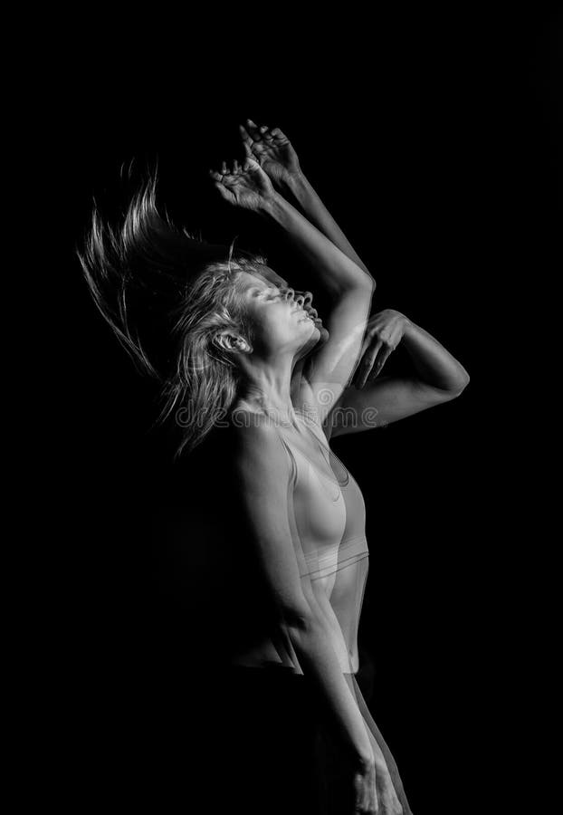 Creative original portrait of the girl throws up her hair. movement effecttriple Multiple exposure black and white photo royalty free stock photo Creative original portrait of the girl throws up her hair. movement effecttriple Multiple exposure black and white photo royalty free stock photo