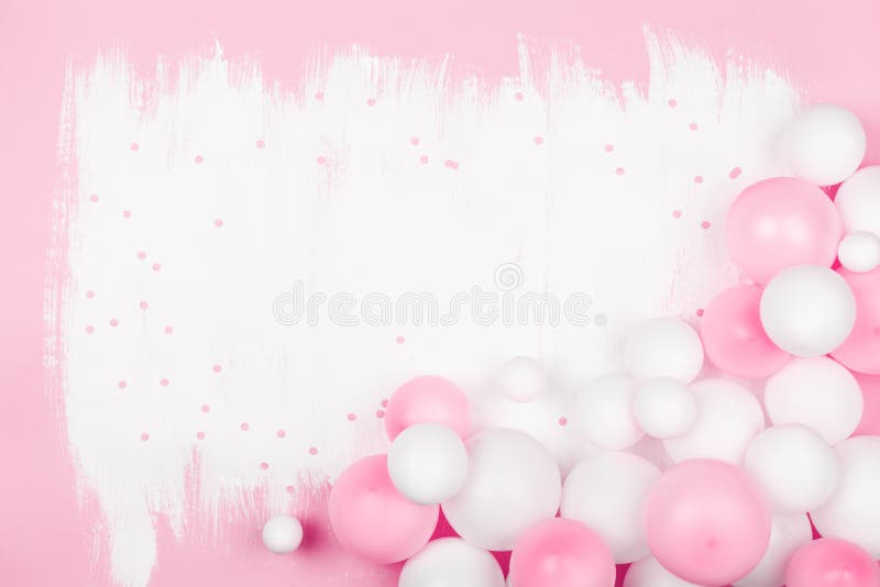 Creative painted background with white pink balloons and confetti. Top view and flat lay style. Birthday or party concept