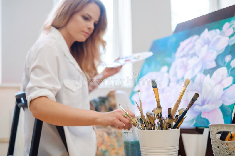 Creative Painter Paints a Colorful Picture in Her Studio Stock Image
