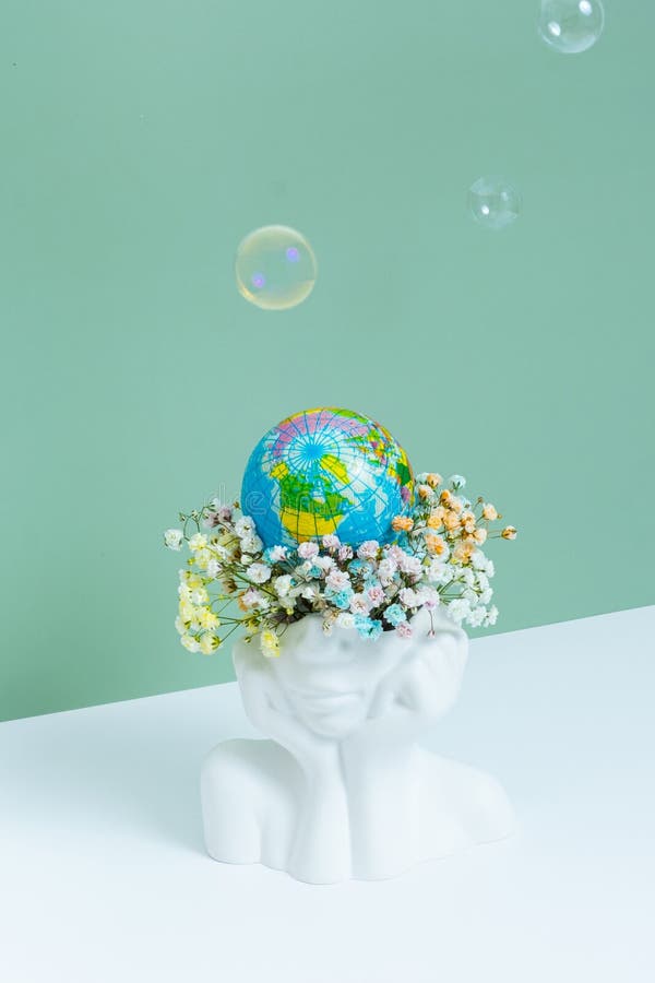 Creative Plaster Vase Headshape with Flowers and World Globe. Save the