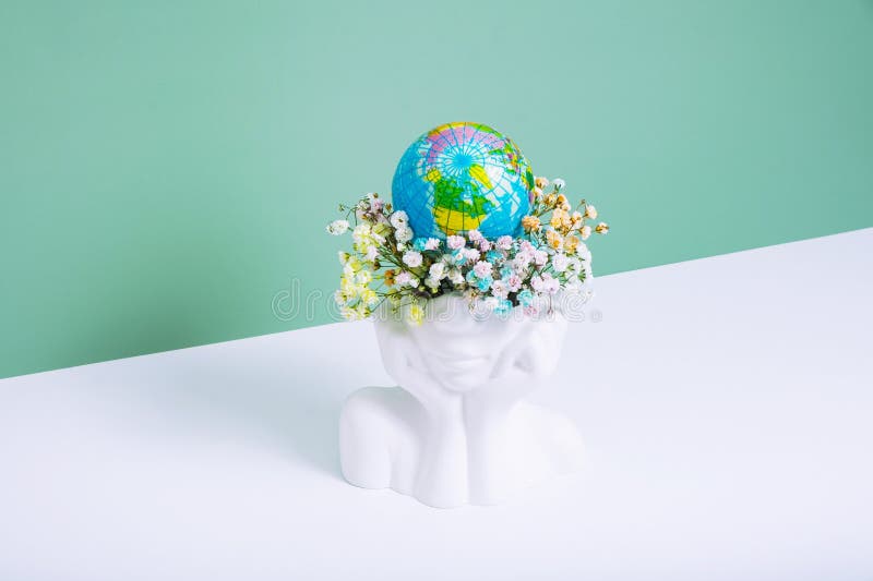 Creative Plaster Vase Headshape with Flowers and World Globe. Save the