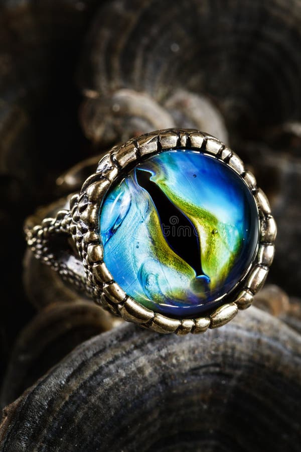 Creative ring with dragon eye on nature background