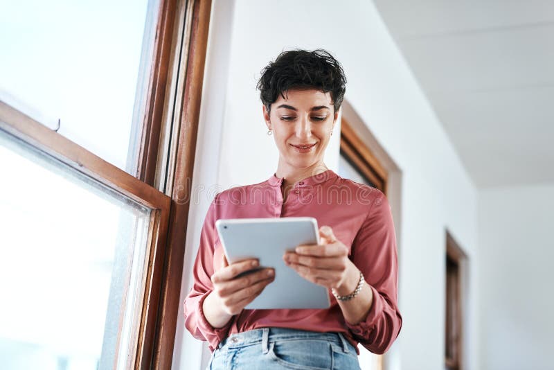 Creative, smile and woman with tablet in office for web development, email or communication. Company, developer and royalty free stock images