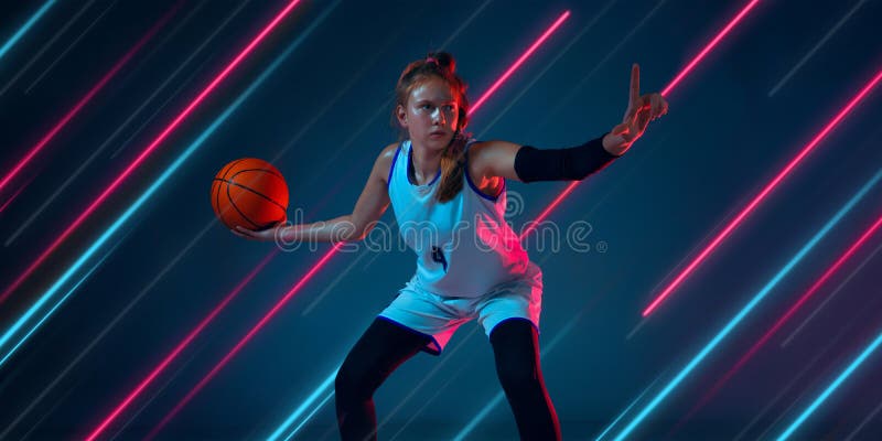 Creative sport and neon lines on dark background, flyer, proposal. Female basketball player training in action and motion. Concept of hobby, healthy lifestyle stock images Creative sport and neon lines on dark background, flyer, proposal. Female basketball player training in action and motion. Concept of hobby, healthy lifestyle stock images