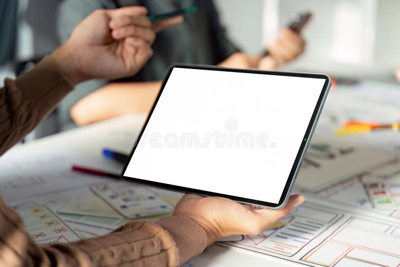 Modern UX UI Design Process with Digital Tablet and Creative Team Collaboration in Office Environment stock image