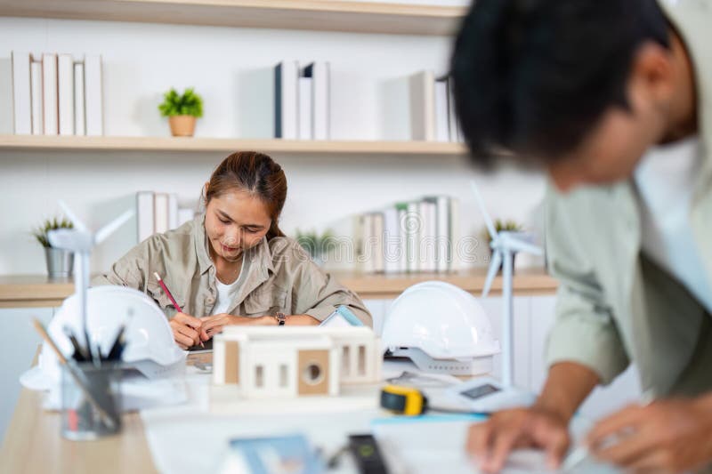 Creative Teamwork in Architecture. Young professionals designing sustainable model. stock image