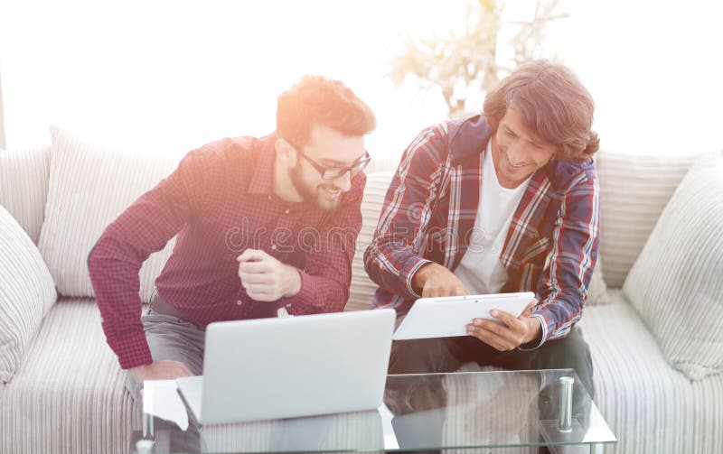 Creative web designers working with a tablet and a laptop. stock image Creative web designers working with a tablet and a laptop. stock image