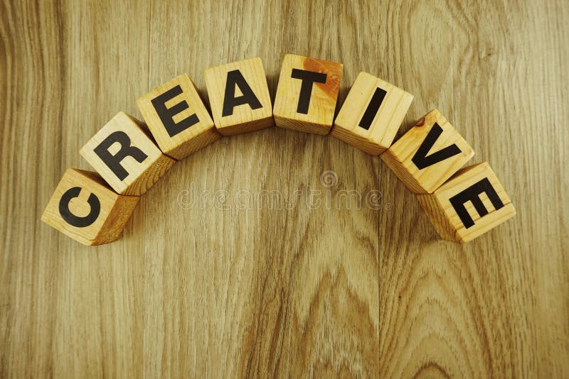 Creative Word Made from Wooden Cubes with Letters Alphabet Stock Photo