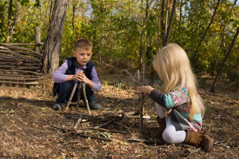 Creative Young Boy and Girl Playing with Branches Stock Image - Image ...