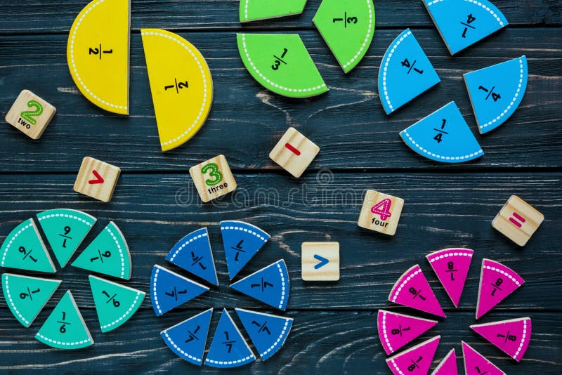 Creative Сolorful math fractions on dark background. Interesting funny math for kids. Education, back to school concept royalty free stock images Creative Сolorful math fractions on dark background. Interesting funny math for kids. Education, back to school concept royalty free stock images