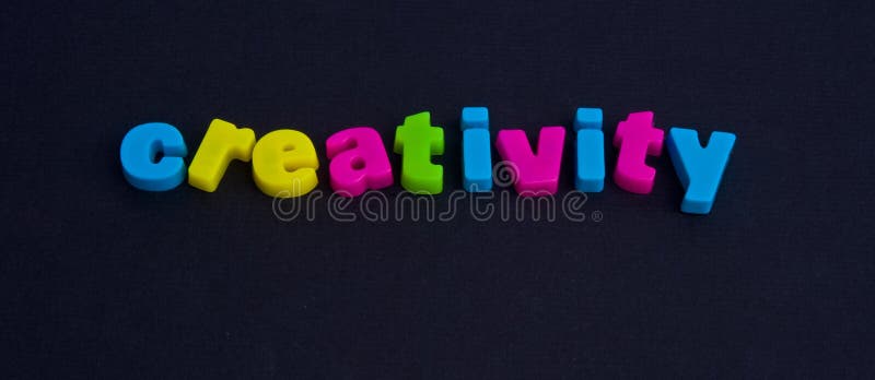 A macro image of the word creativity in colorful lower case letters isolated on a dark background. Word art letters stock images, royalty-free photos and pictures