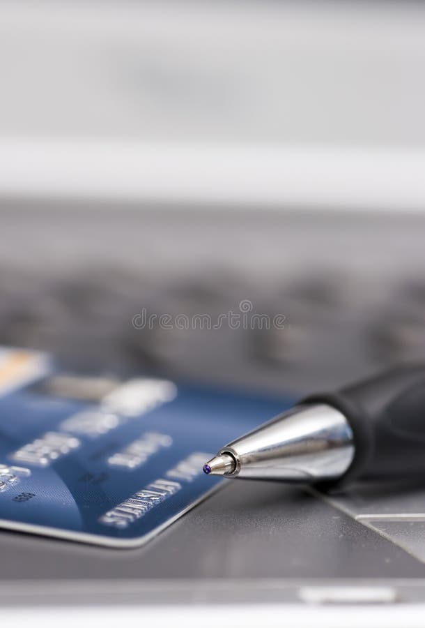 Credit card, pen and computer