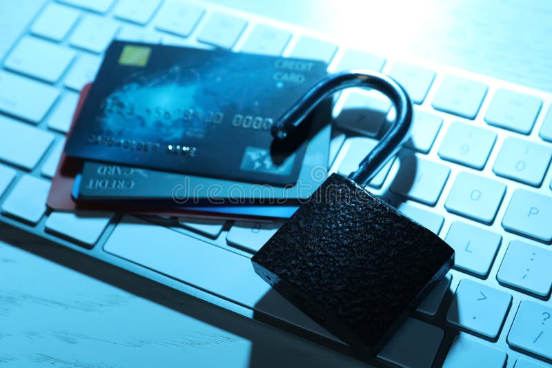 Credit Cards, Lock and Computer Keyboard on Table. Cyber Crime Stock