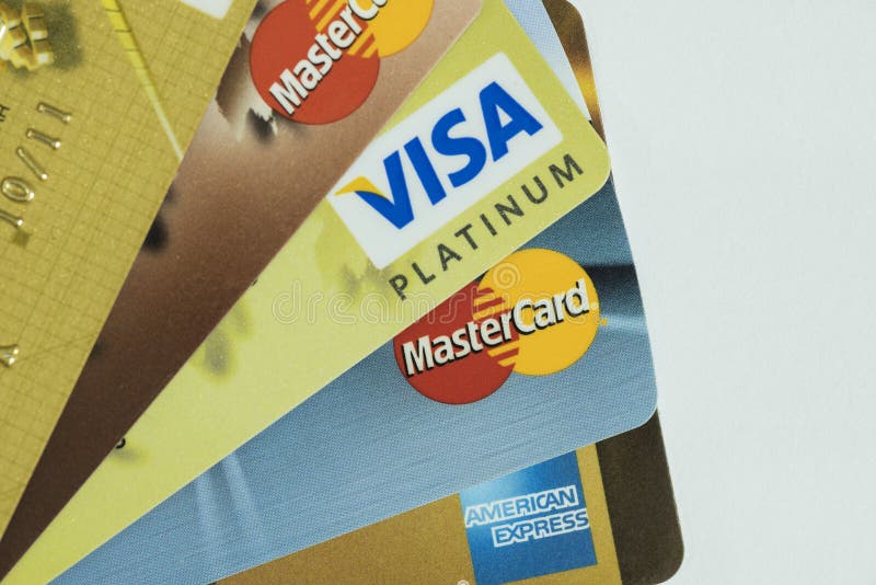 Macro image of all major credit card companies. Visa, American Express and Mastercard credit cards are shown in great detail.