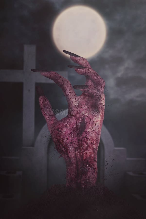 Creepy bloody zombie hand at cemetery stock image Creepy bloody zombie hand at cemetery stock image